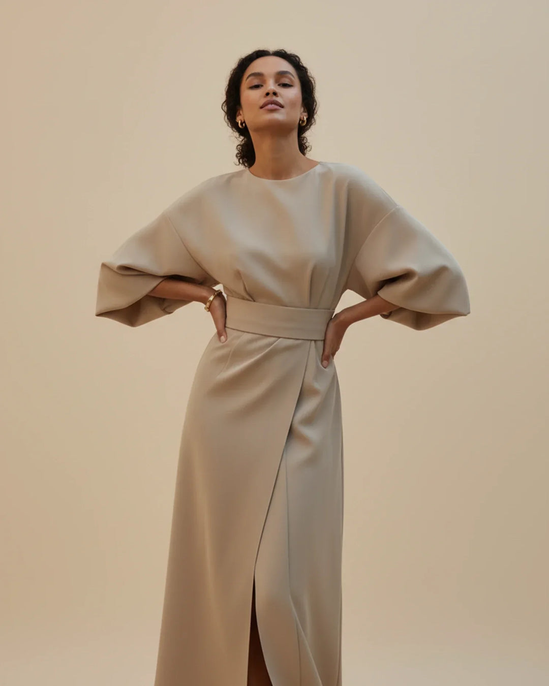 Women's versatile midi dress, a smart wrap with distinctive lantern sleeves and a waist-defining belt.