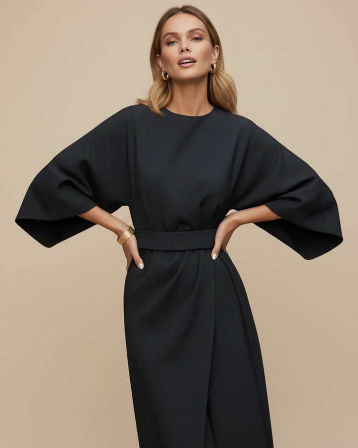 Chic women's midi wrap dress with flowing lantern sleeves and a flattering belted waist for spring/summer.
