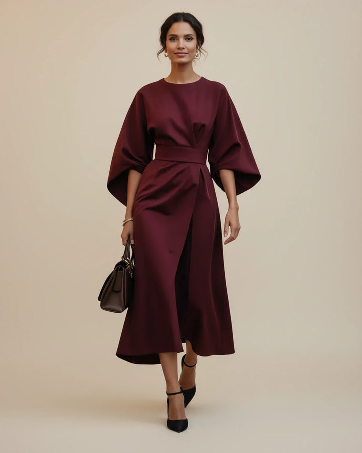 Modern women's wrap midi dress with lantern sleeves and a tie belt, offering a comfortable yet chic style.