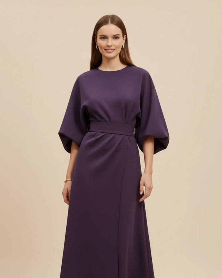Sophisticated women's office midi dress: a wrap style with voluminous lantern sleeves and a defined belt.