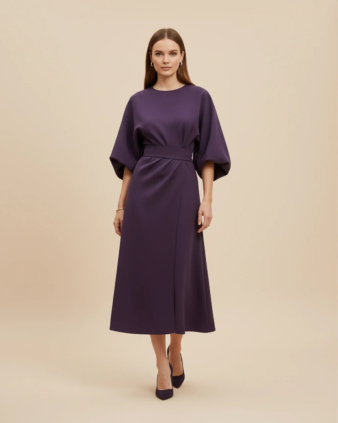 Stylish women's midi dress featuring a belted wrap design, beautiful lantern sleeves, and a flattering fit.