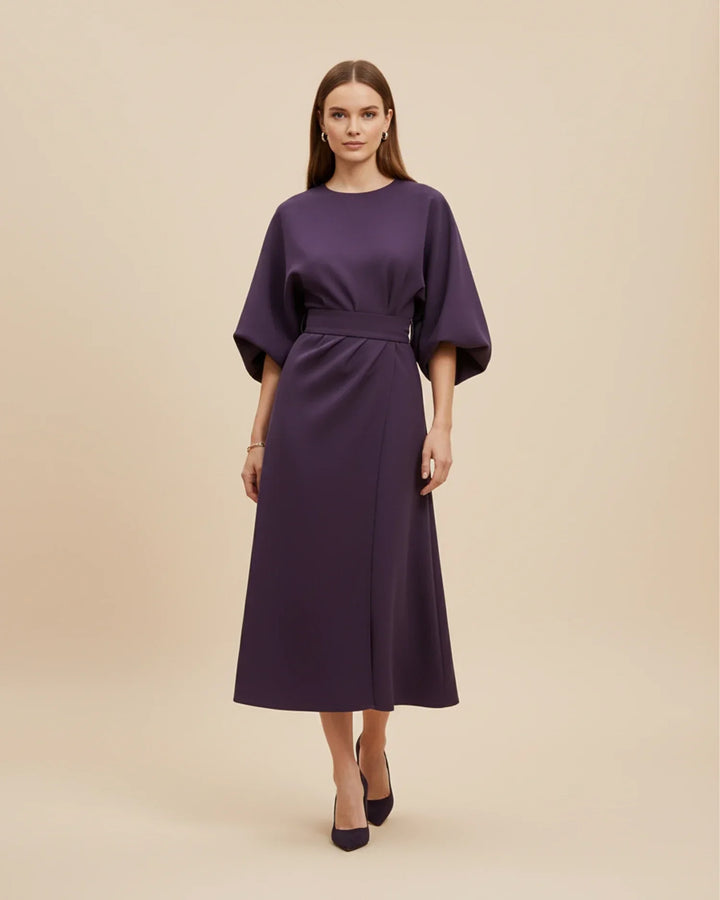 Stylish women's midi dress featuring a belted wrap design, beautiful lantern sleeves, and a flattering fit.