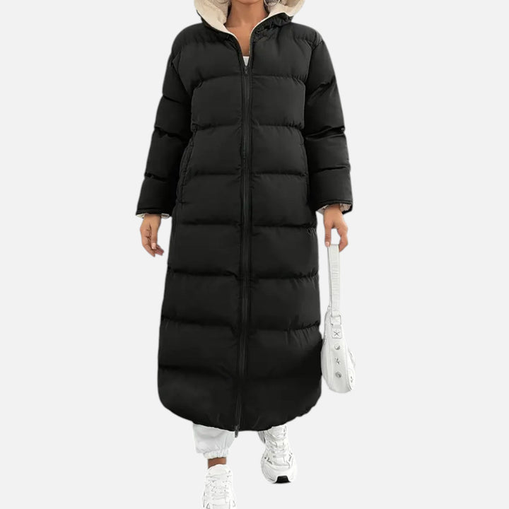 Women's elegant long black puffer coat with hood, perfect for stylish winter warmth & cold weather outerwear.
