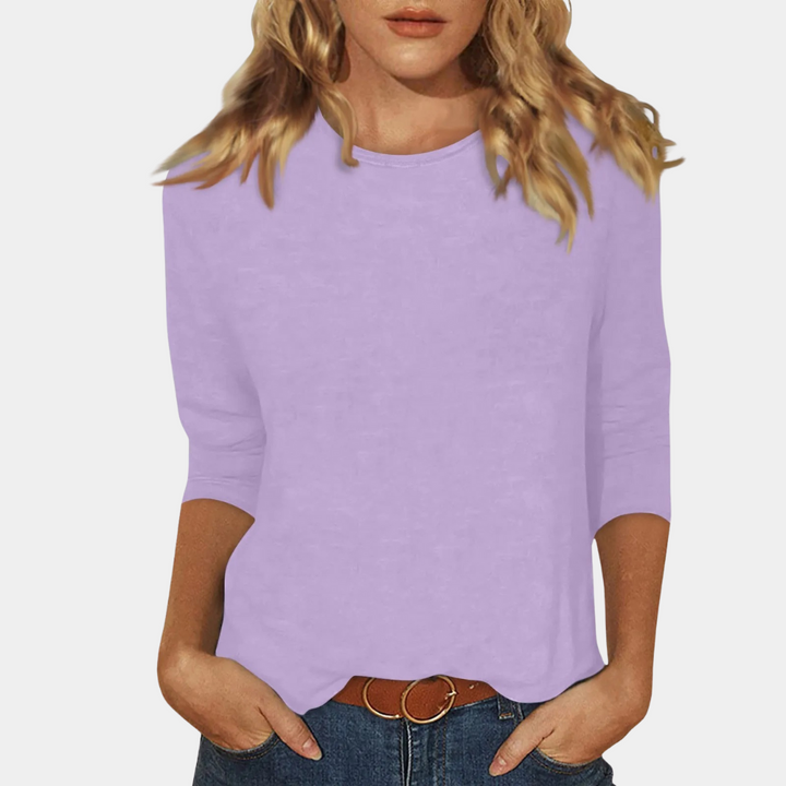 Stylish women's long sleeve t-shirt, comfortable crew neck top. Elegant casual wear, ideal for versatile everyday fashion.