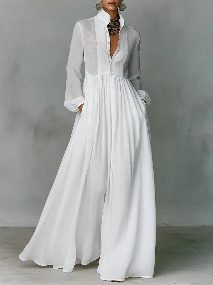 Women's elegant maxi shirt dress with stand collar, button-front, and practical pockets, perfect for versatile everyday wear.