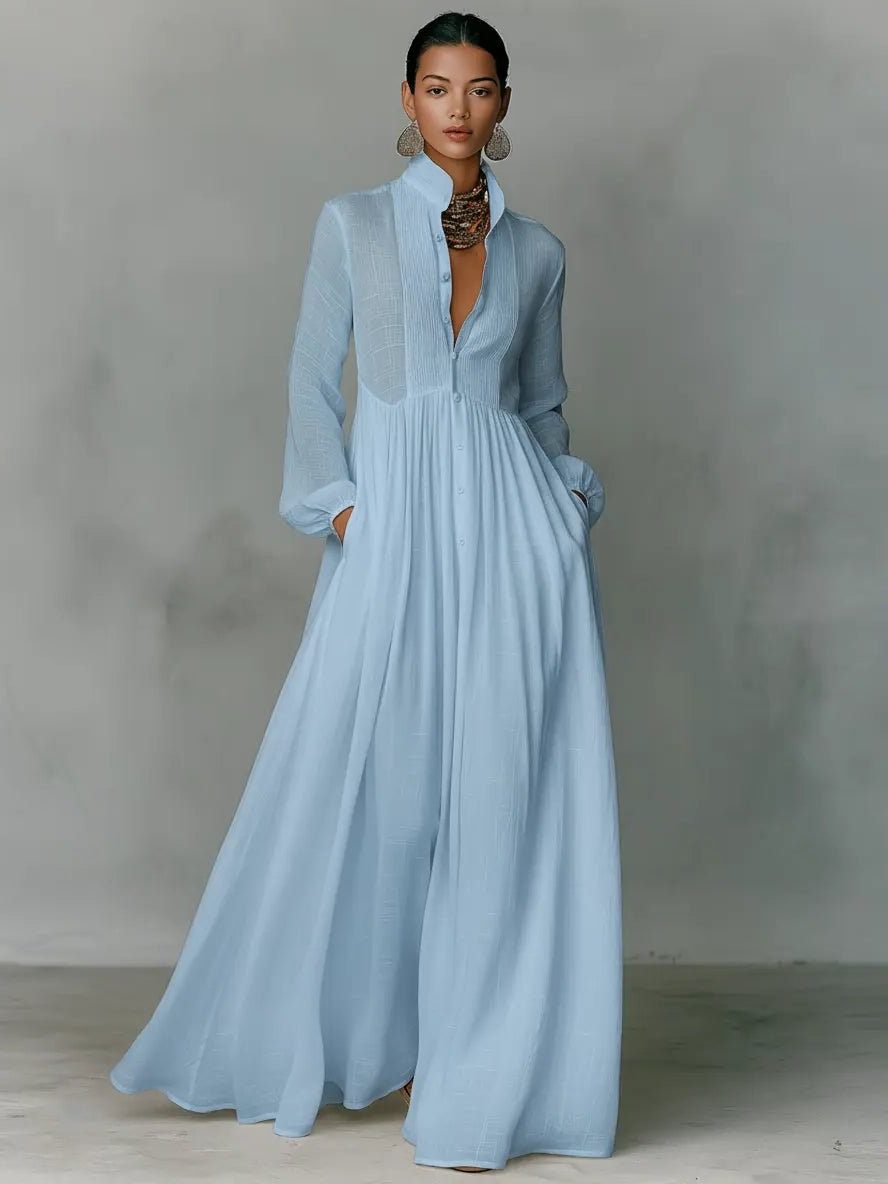 Comfortable women's maxi shirt dress with stand collar & pockets, a versatile long button-front dress for any occasion.