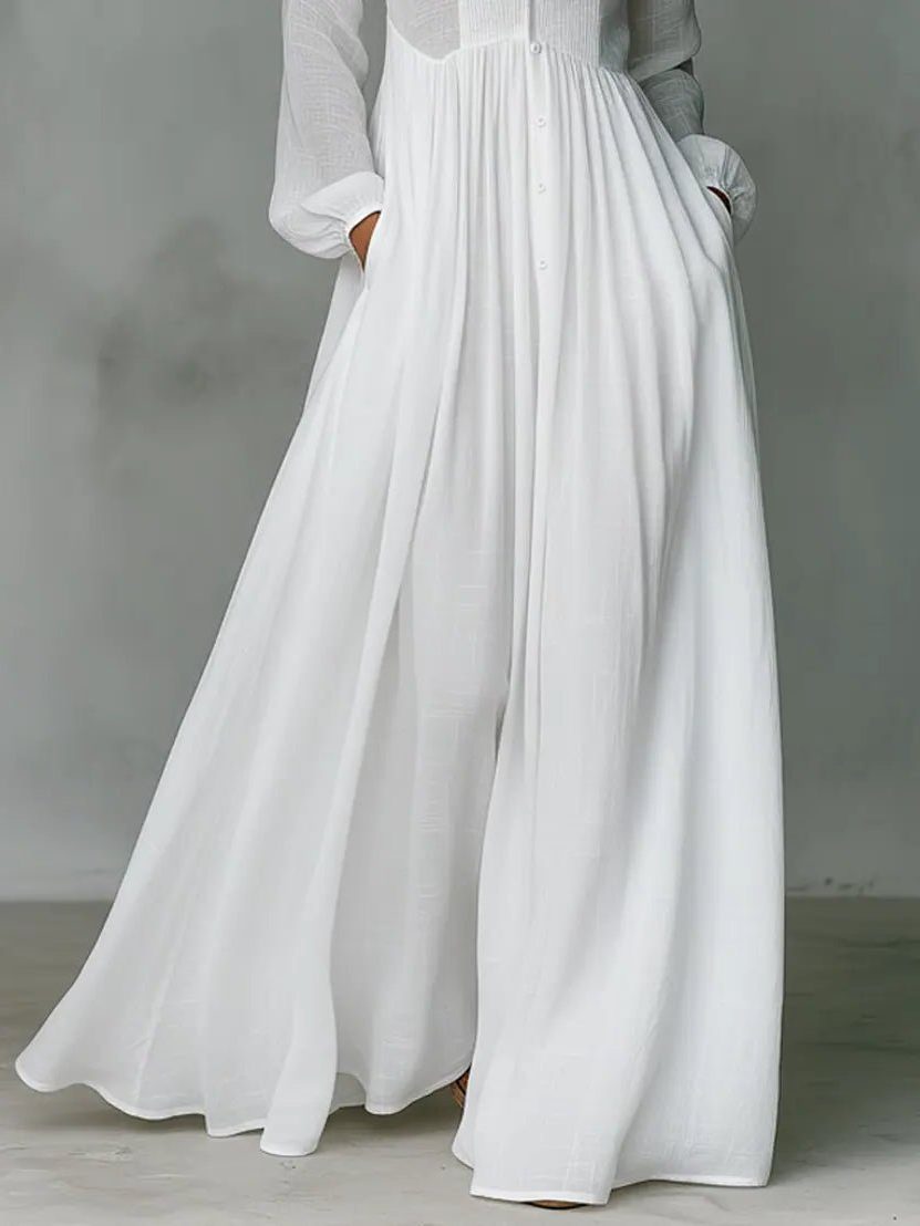 Stylish women's long button-front shirt dress with stand collar & pockets, a comfortable & elegant choice for daily wear.