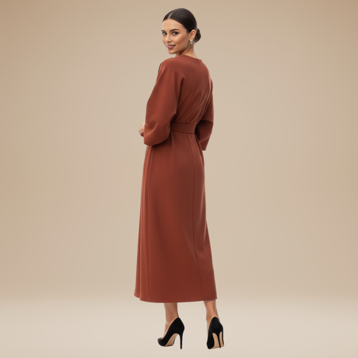 Modern women's midi wrap dress, belted for a flattering fit, versatile for various elegant occasions.