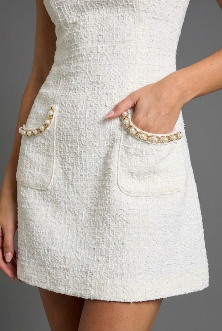 Sophisticated women's pearl trim mini cocktail dress, perfect for elegant evening wear and festive parties.