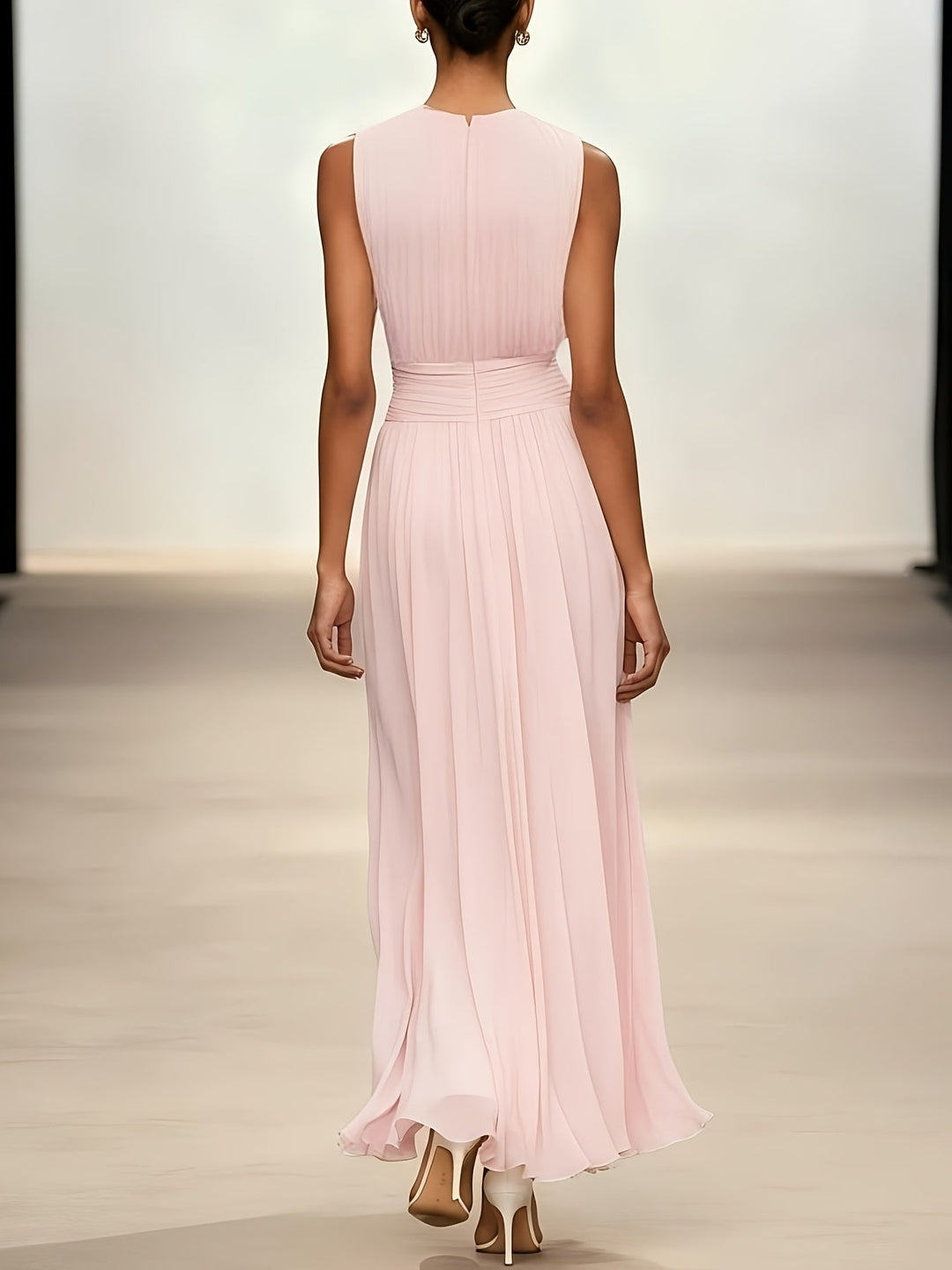 Graceful pleated wedding guest dress, maxi length, featuring a flattering ruched waist for formal elegance.