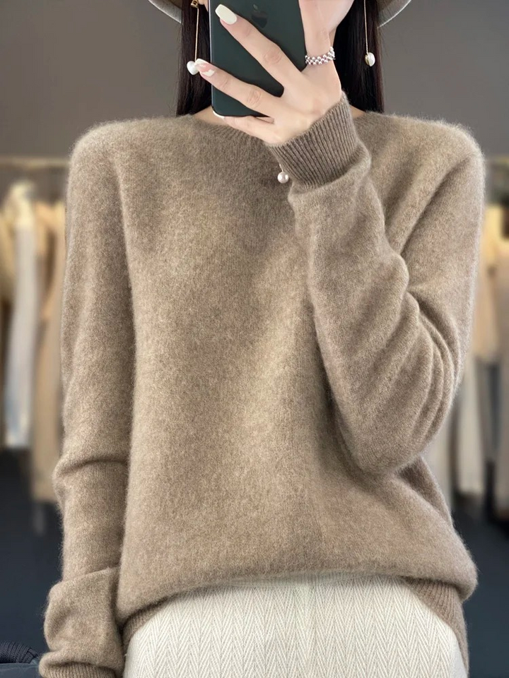 Women's elegant round neck soft knit sweater. Versatile long sleeve top for fall/winter fashion.