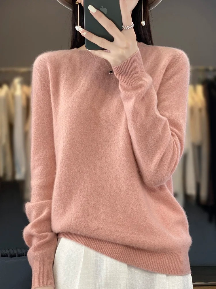 Cozy women's long sleeve sweater. Soft knit round neck design, perfect for cool weather comfort.