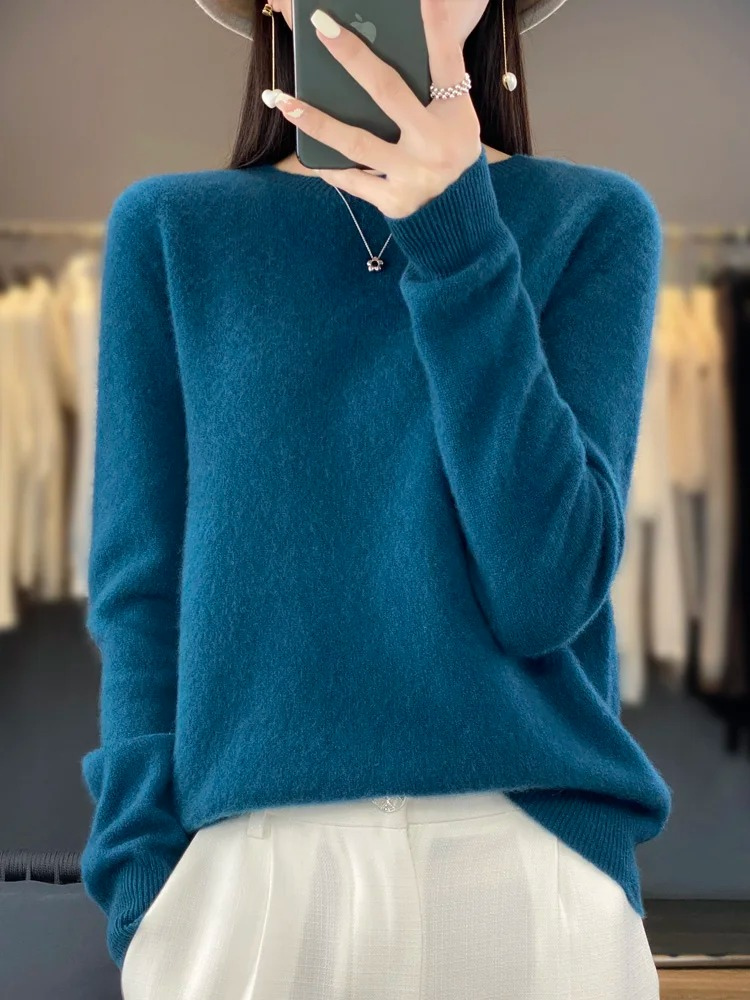 Elegant women's knit sweater. Round neck, long sleeve, perfect for fall & winter chic style.