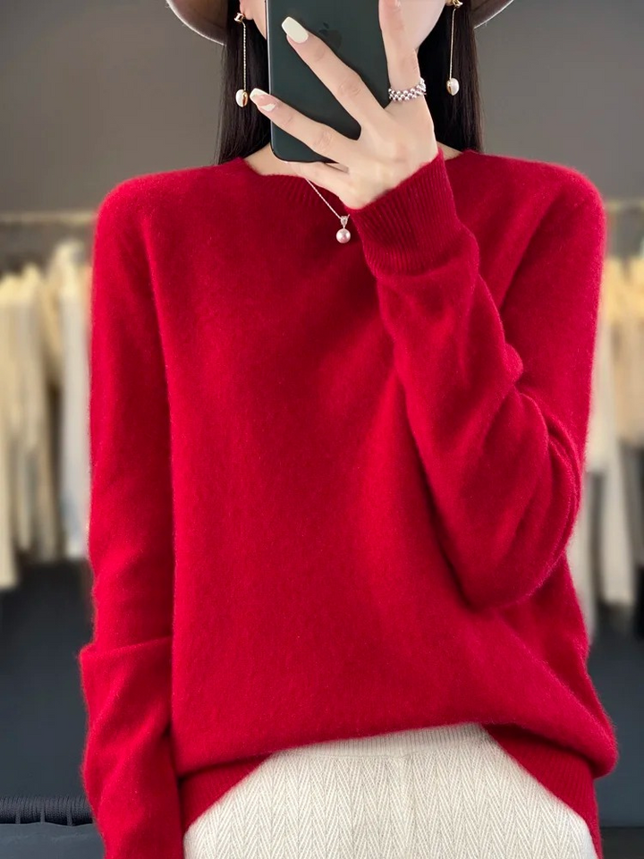 Versatile women's long sleeve knit top. Soft round neck sweater for chic everyday looks.