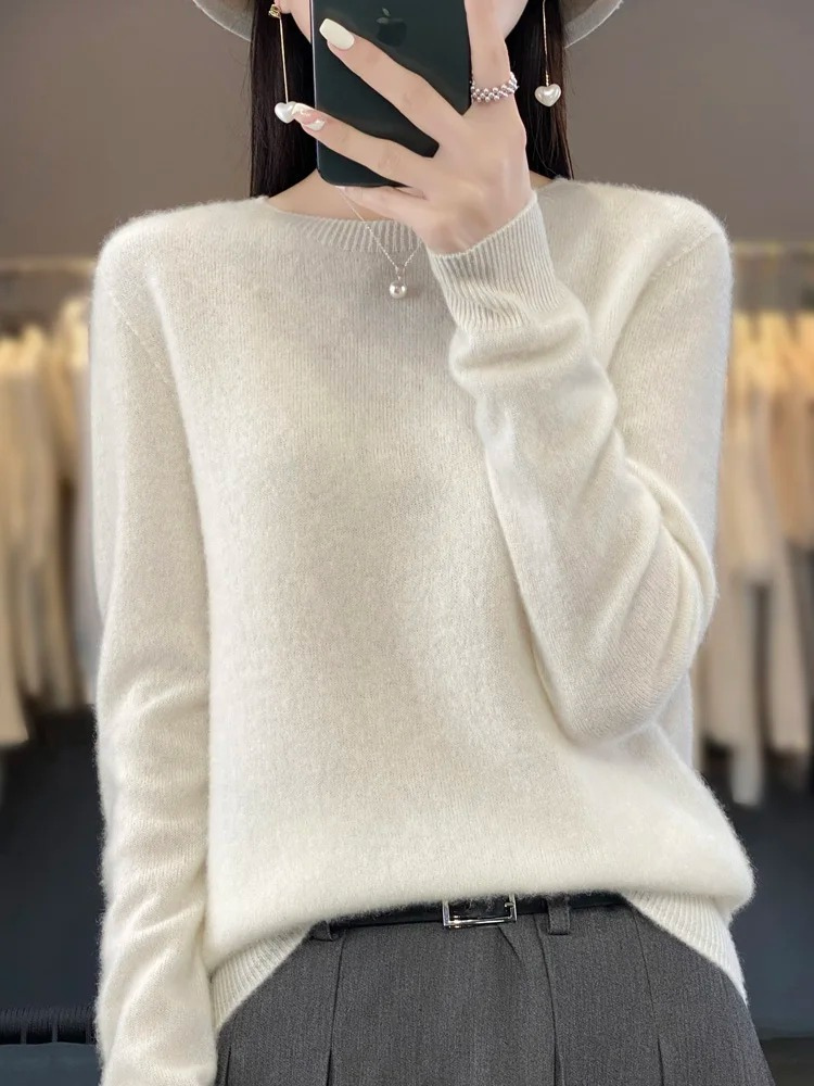 Women's fall fashion: soft round neck knit sweater. Elegant, comfortable, and long-sleeved pullover.