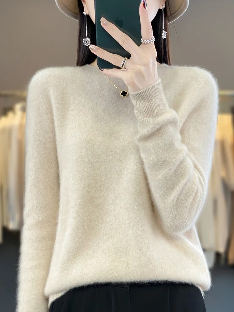 Soft knit women's sweater with a classic round neck. Elegant & versatile for various outfits.