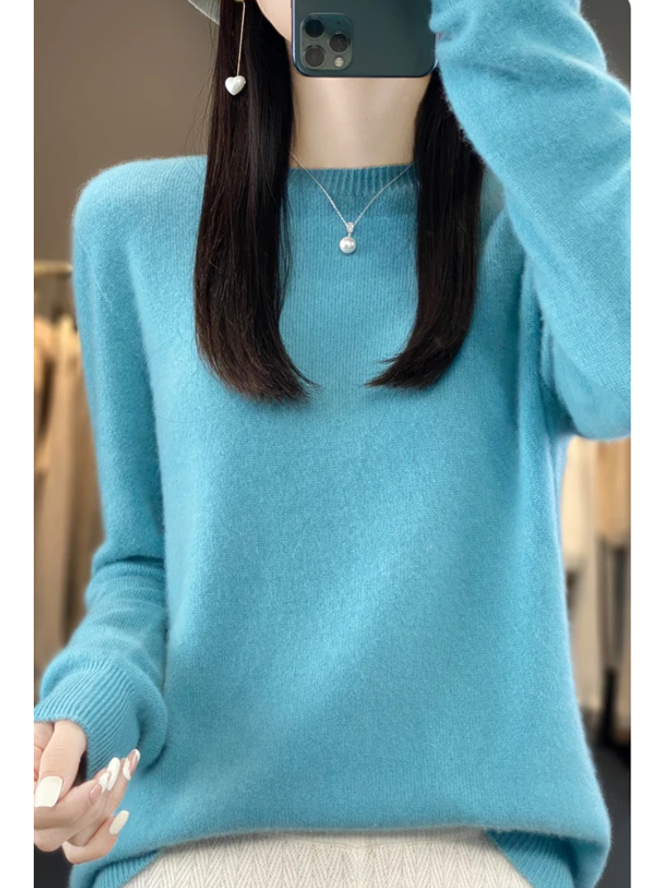Classic women's round neck pullover. Soft knit, long sleeve, perfect for elegant layering.