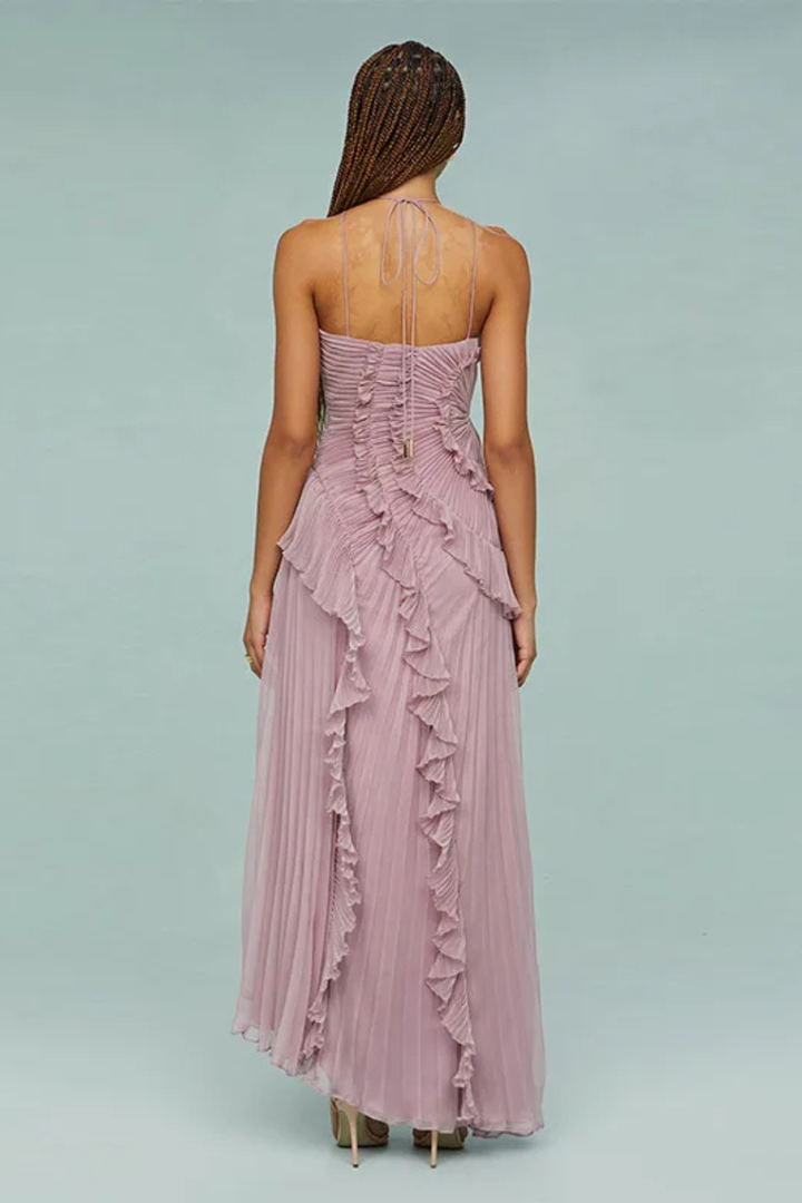 Stylish women's summer wedding guest dress: sleeveless ruffled halter maxi with an asymmetric hem.
