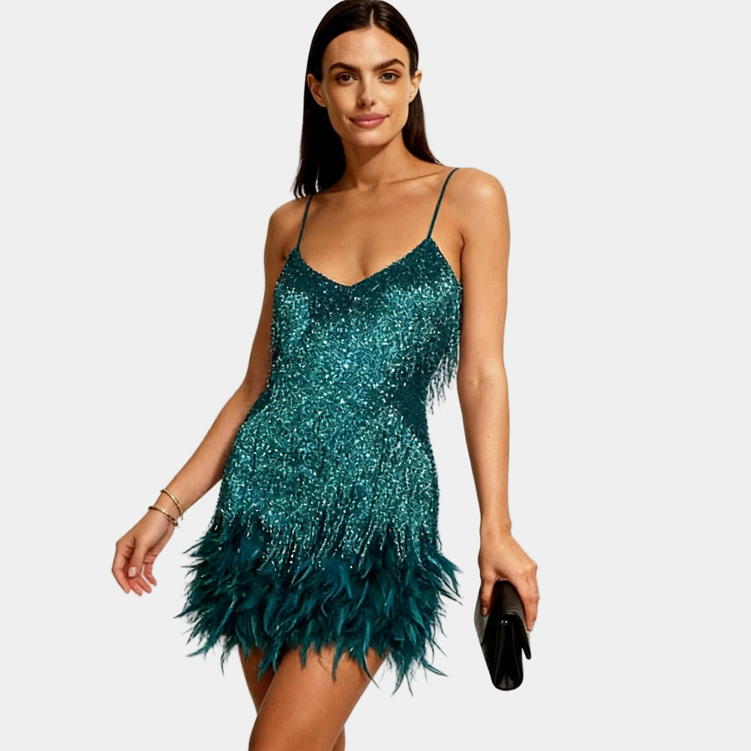 Elegant women's spaghetti strap sequin mini dress featuring playful feather details for parties.