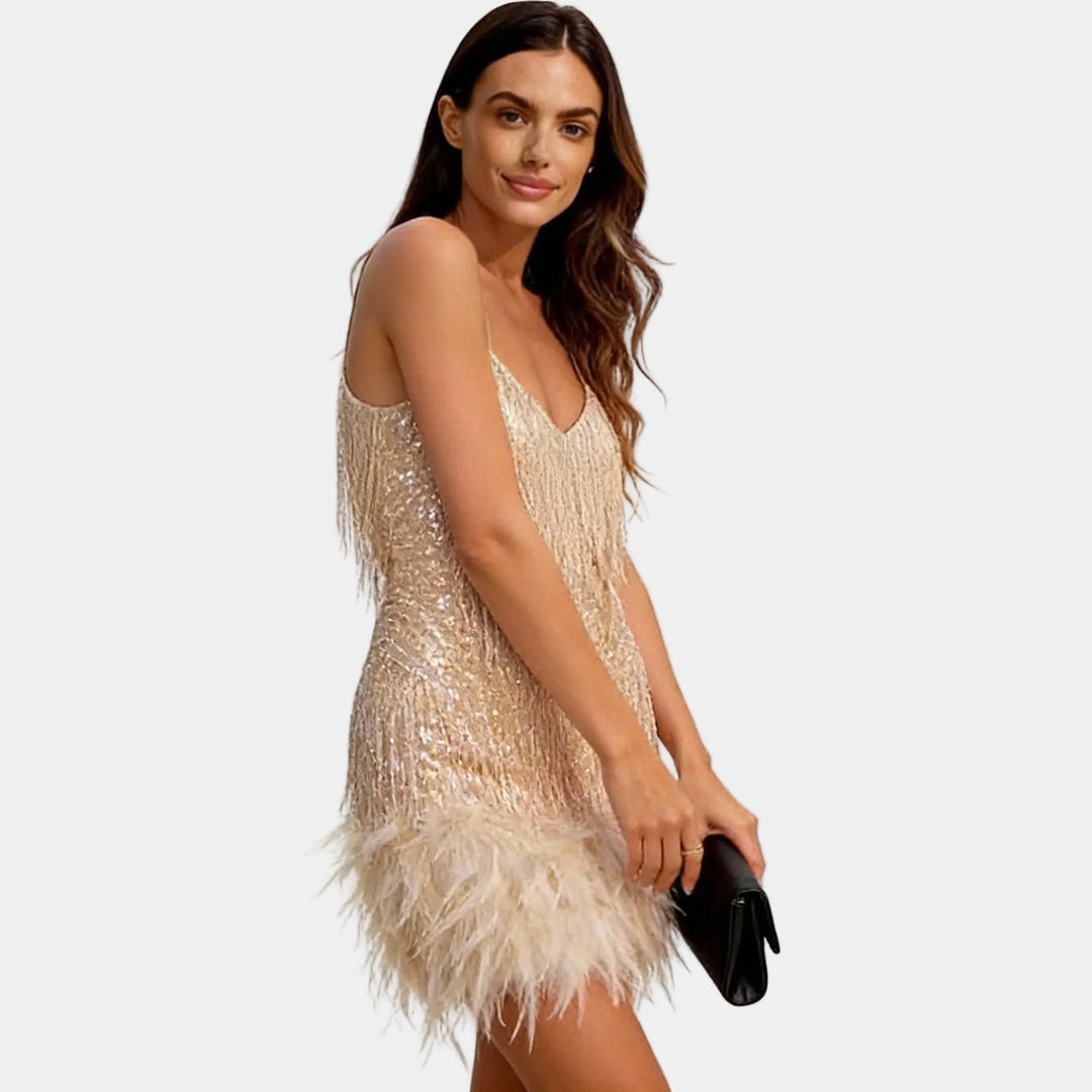 Women's sparkling sequin mini dress with a lavish feather trim, ideal for festive celebrations.