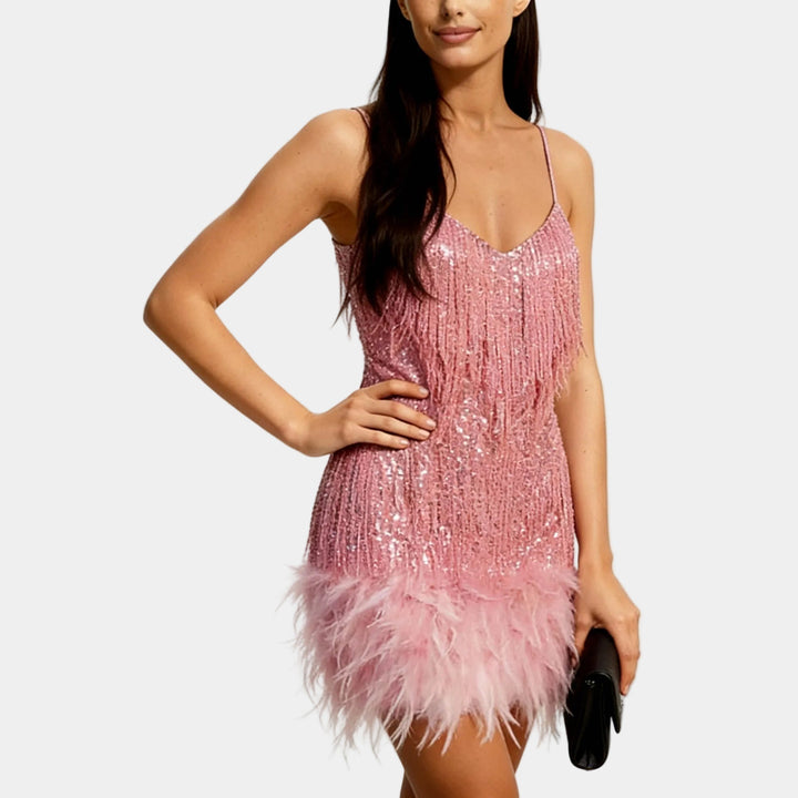 Stylish women's sequined mini dress with a feather-trimmed hem, perfect for dancing and parties.