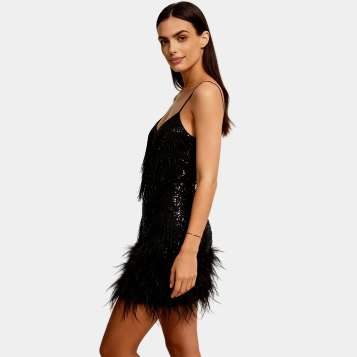 Glamorous sequined mini dress for women, featuring chic feather trim, perfect for cocktail parties.