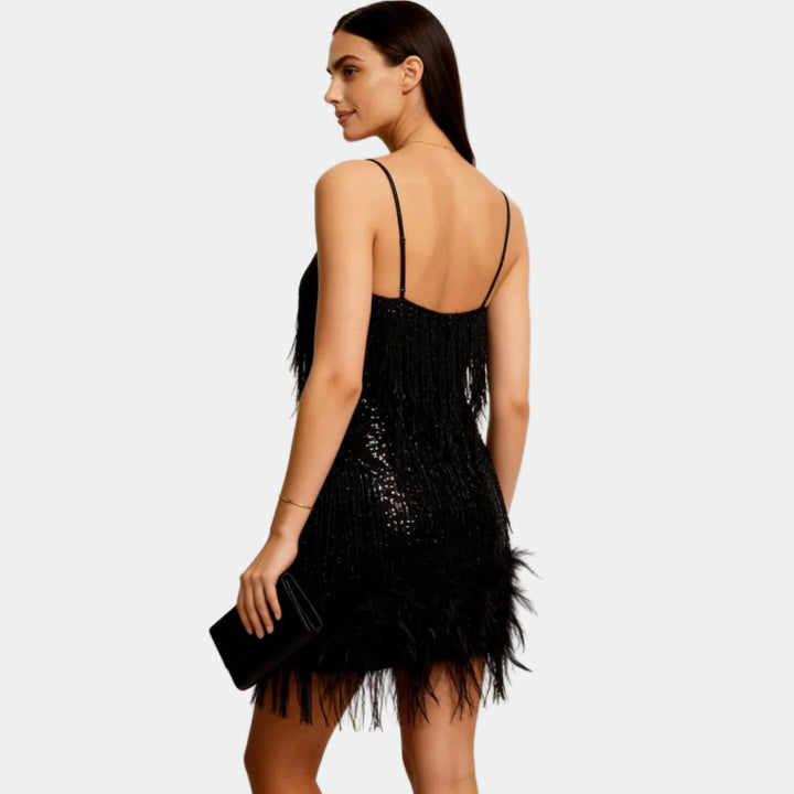 Dazzling women's short sequin dress with feather trim, an ideal choice for formal events and nights out.