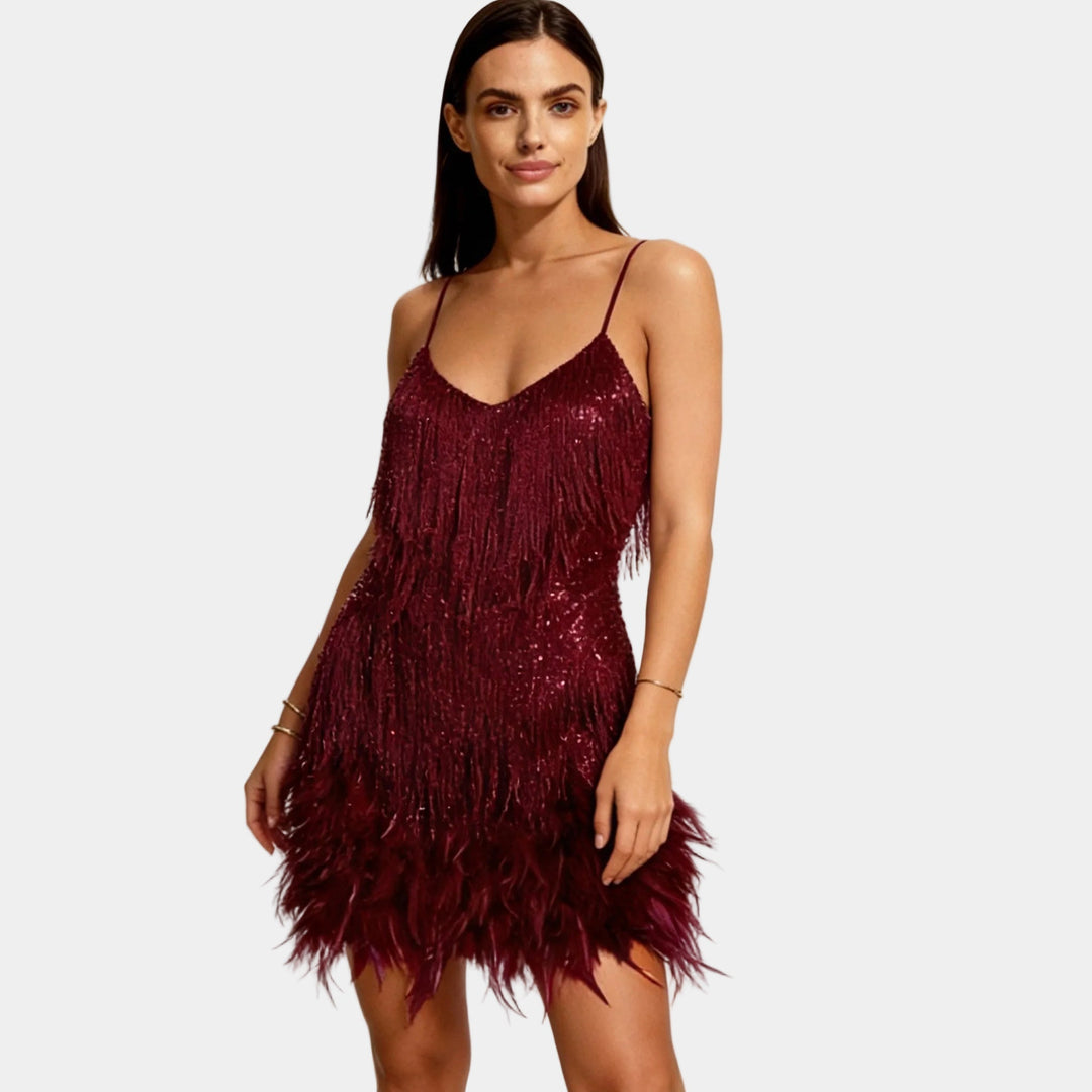 Chic women's sequin mini cocktail dress with delicate feather detailing and spaghetti straps.