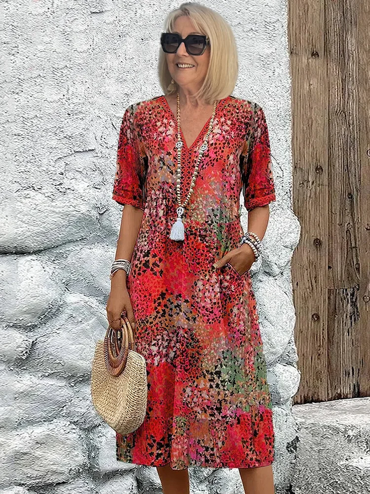 Women's elegant V-neck A-line midi dress featuring a vibrant print, perfect for summer casual and daily wear.