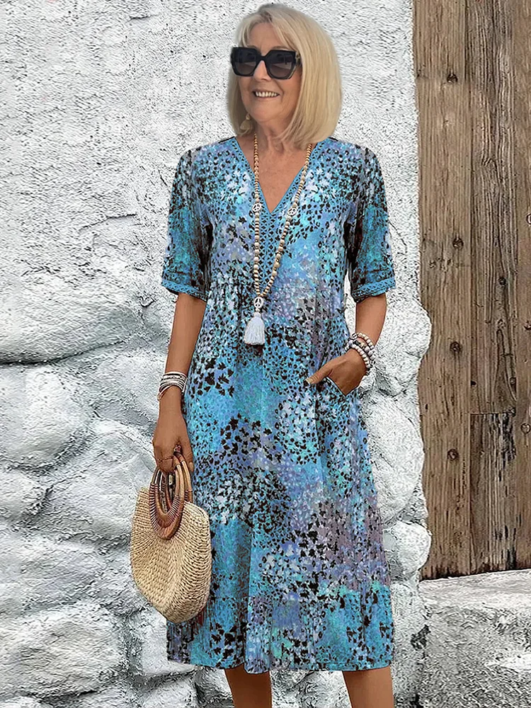Comfortable women's printed V-neck A-line midi dress, ideal for a stylish summer look or elegant daily wear.