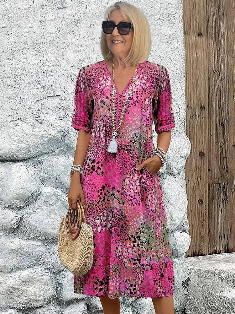 Flattering women's V-neck A-line midi dress with a unique print, great for casual summer events and comfort.