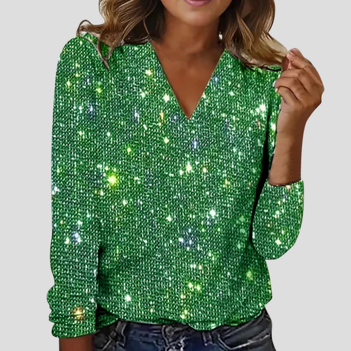 Elegant women's long sleeve glitter top with a flattering V-neck, a chic addition to party wear fashion.