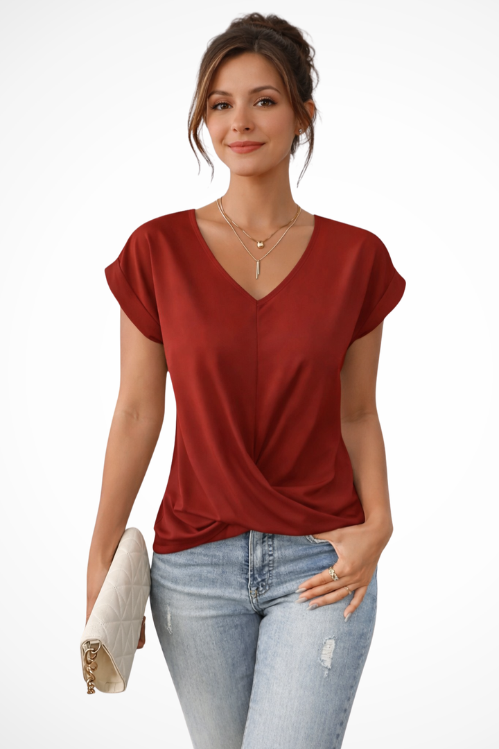 Comfortable women's short sleeve V-neck blouse with a trendy twist hem, great for casual outings.