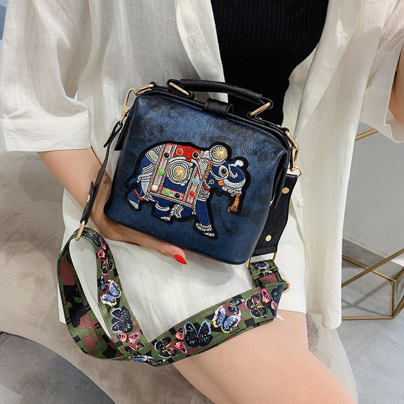 Multi-use women's bohemian embroidered bag with an intricate mandala design.