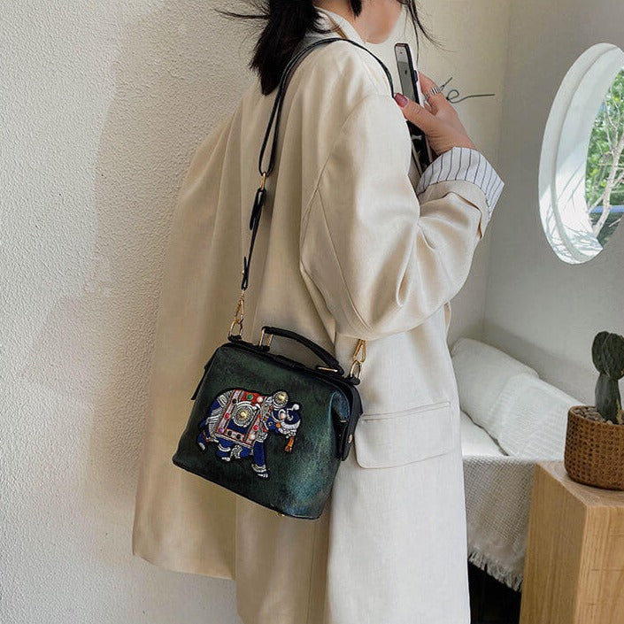 Versatile women's bohemian handbag with intricate mandala embroidery.