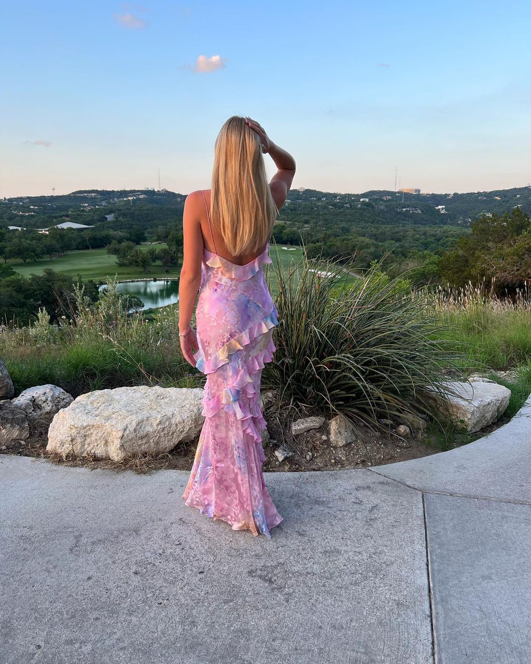 Elegant open-back women's maxi dress with ruffles. Perfect pastel party dress for special occasions or summer.
