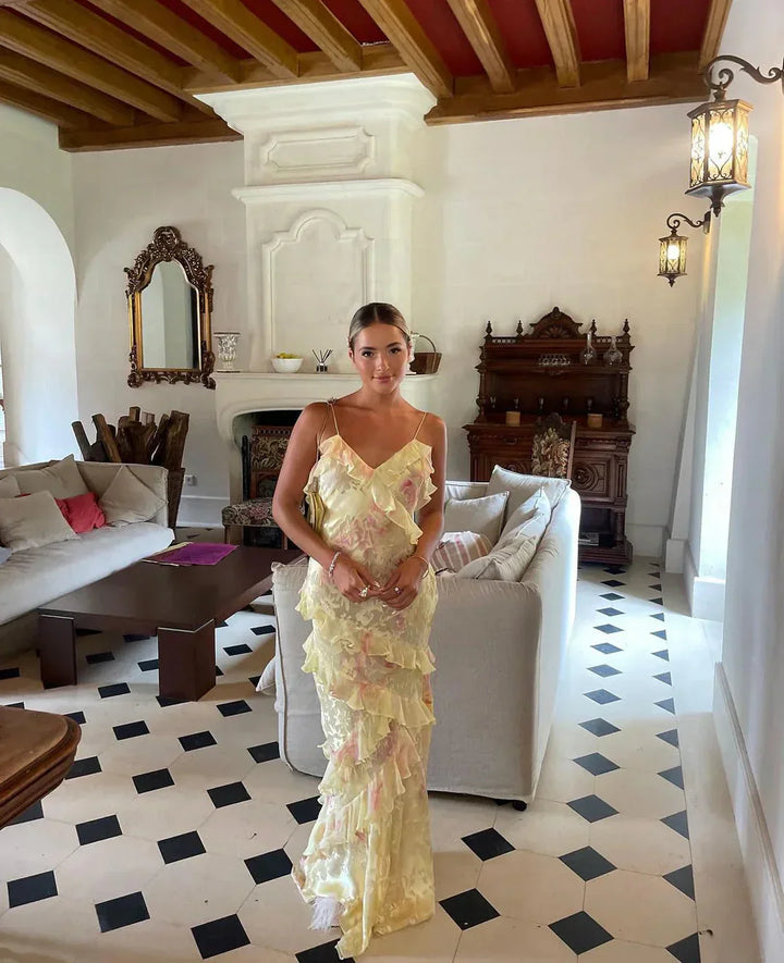 Women's formal ruffle maxi dress. Ethereal flowy evening gown in pastel, suitable for elegant special occasions.