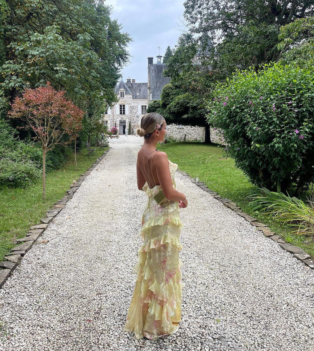 Pastel women's flowy ruffle maxi dress. An elegant summer dress with open back for evening and party wear.