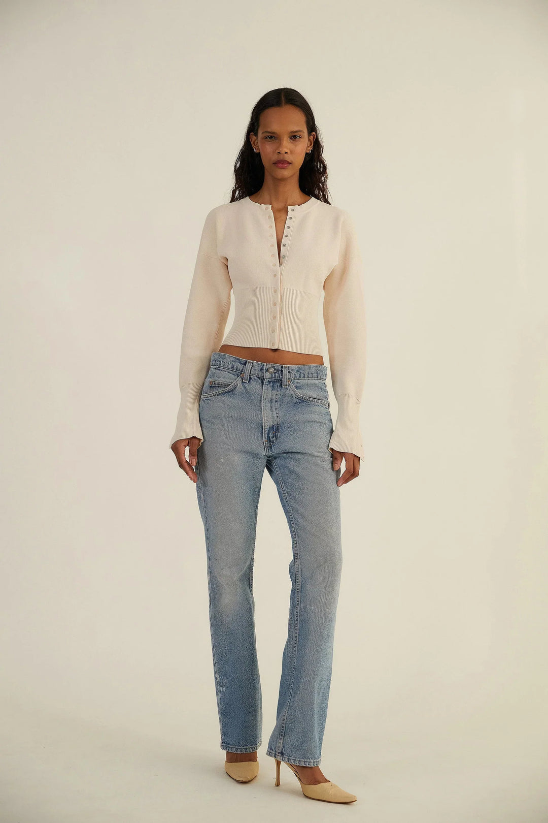 Stylish women's fitted cropped cardigan with button-up front, ideal for layering or solo wear.
