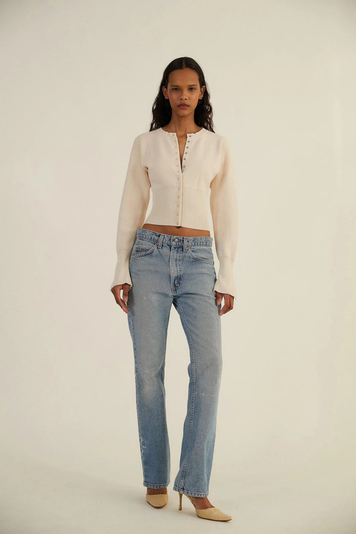 Stylish women's fitted cropped cardigan with button-up front, ideal for layering or solo wear.