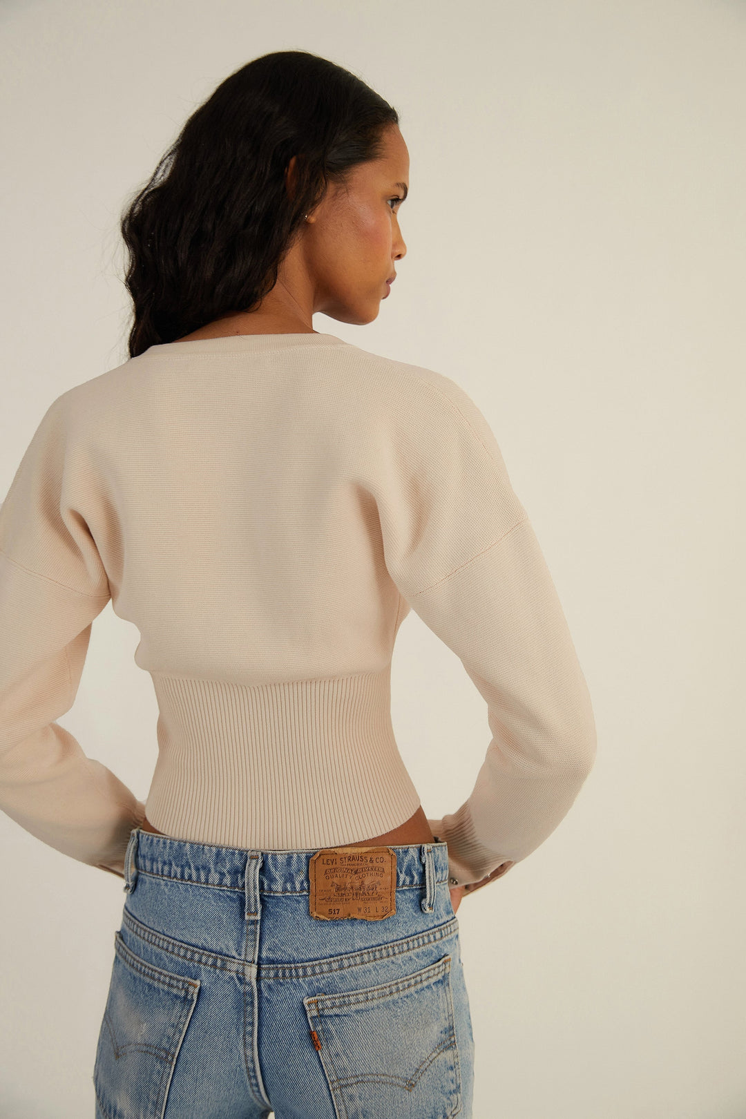 Elegant women's long sleeve fitted cropped cardigan, button-up design for a modern look.