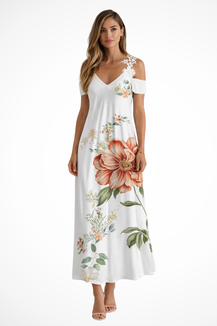Women's floral cold-shoulder maxi dress, flowing for summer style and comfort.