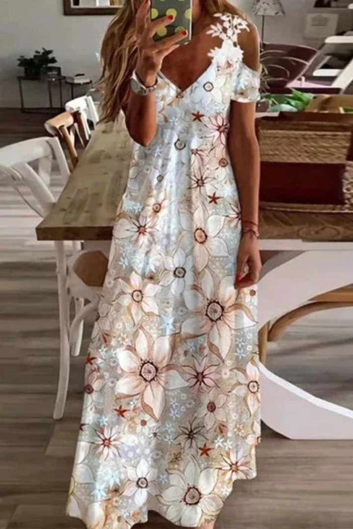 Chic women's floral cold-shoulder maxi dress, a trendy summer fashion statement.