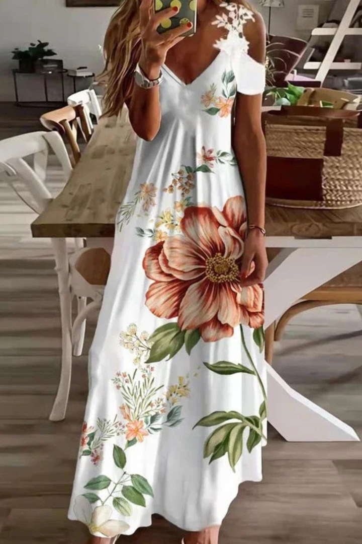 Elegant cold-shoulder detail on a women's vibrant floral print maxi dress.