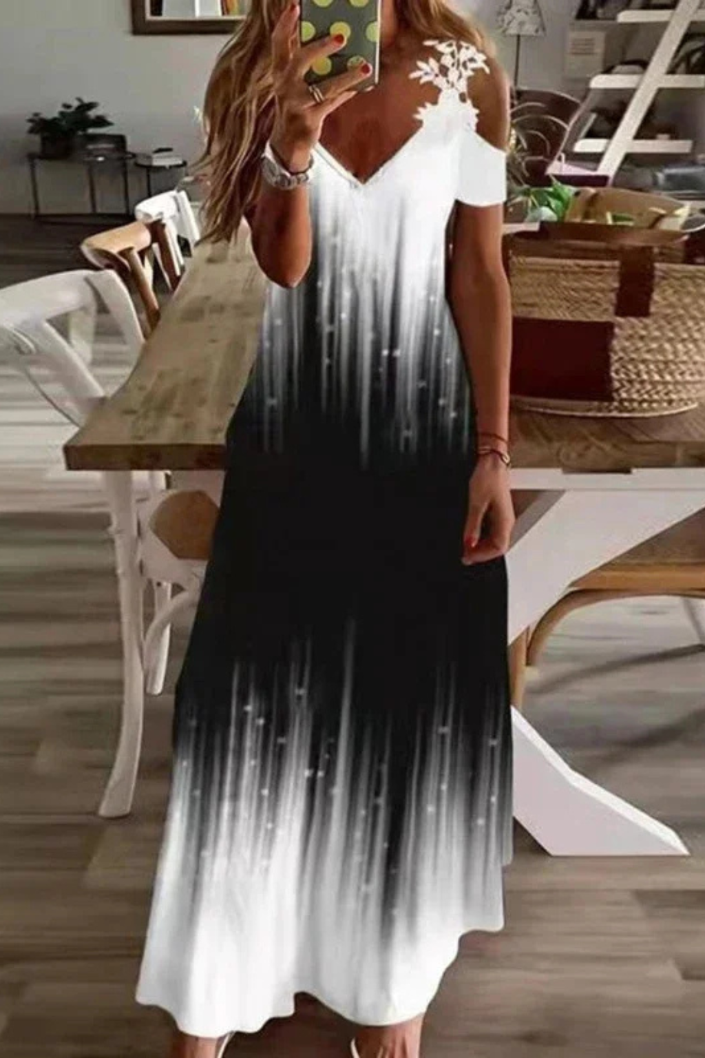 Trendy women's floral cold-shoulder maxi dress, ideal for beach vacation.