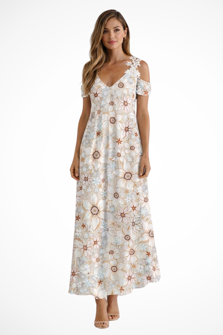 Women's floral cold-shoulder maxi dress in motion, showing flowing silhouette.