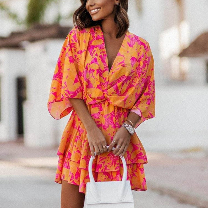 Stylish women's floral mini summer dress with a playful ruffle hem, ideal for boho-chic casual daywear or a holiday.