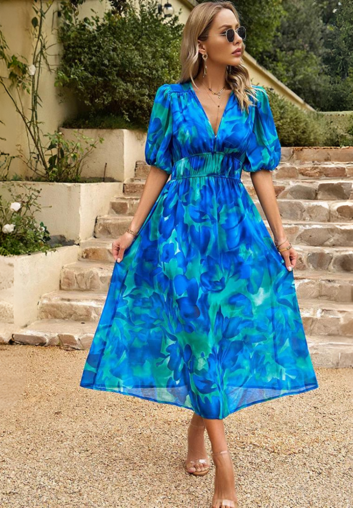 Women's A-line floral midi dress, puff sleeves, V-neck; chic and comfortable for summer days.