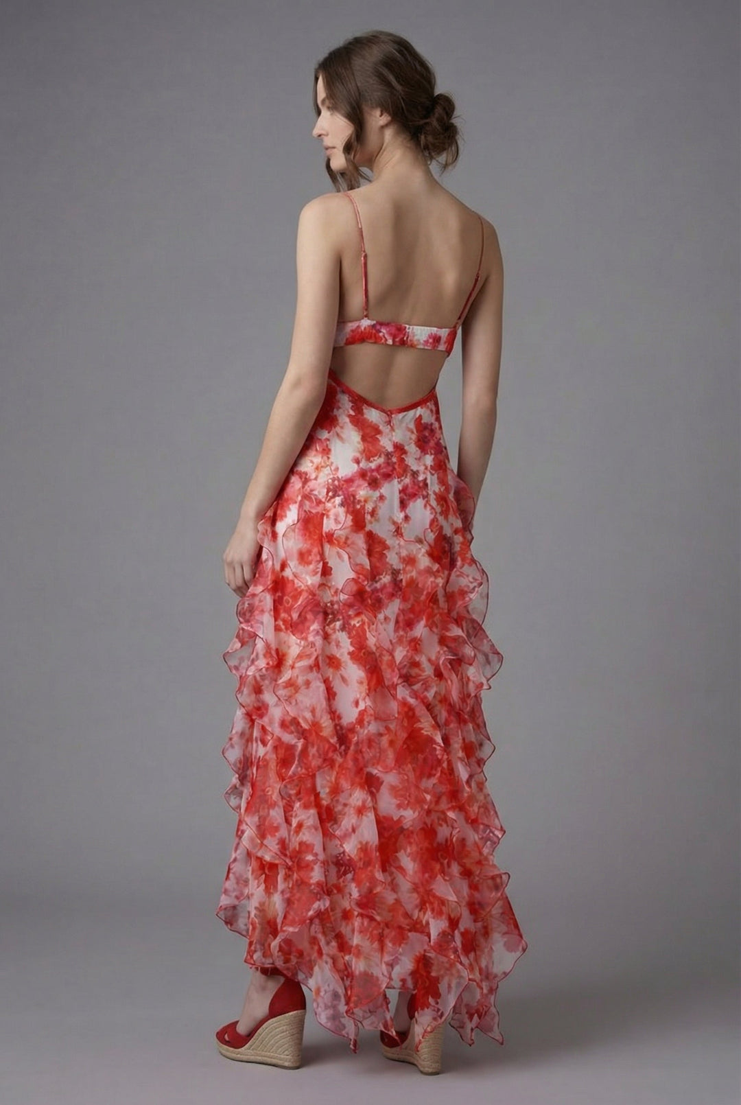 Vibrant floral print summer maxi dress with delicate ruffles, adjustable spaghetti straps, and an open back.