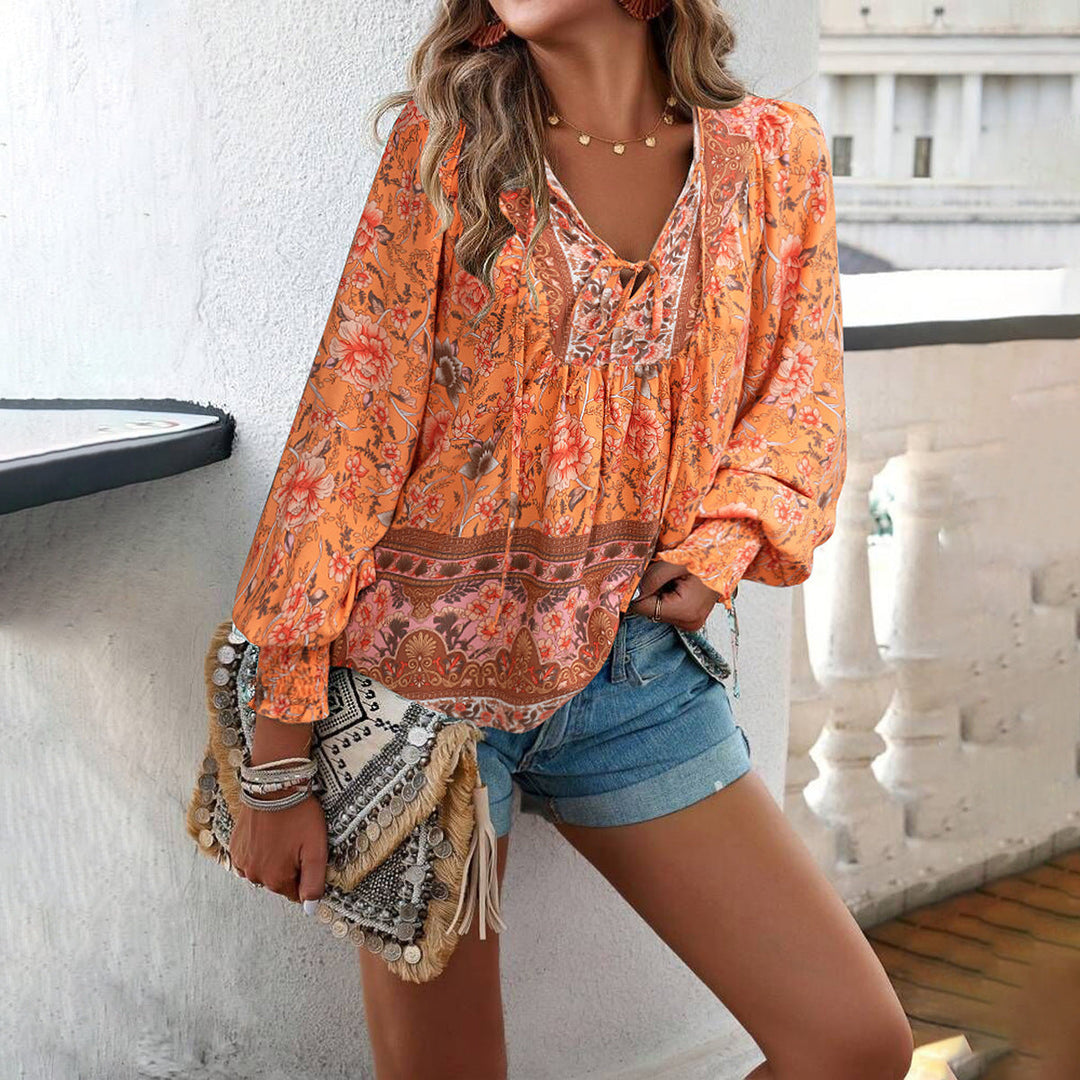 Women's stylish floral long sleeve blouse featuring a flattering tie-front. Breathable & comfortable.